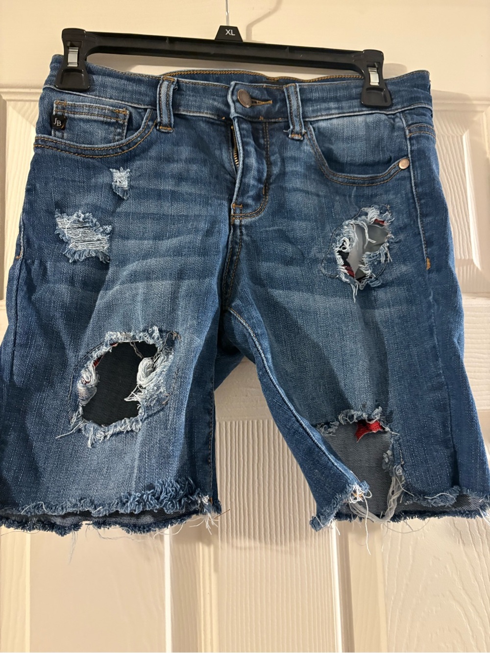 Judy Blue Distressed Denim Shorts in Blue with Red Underlay
